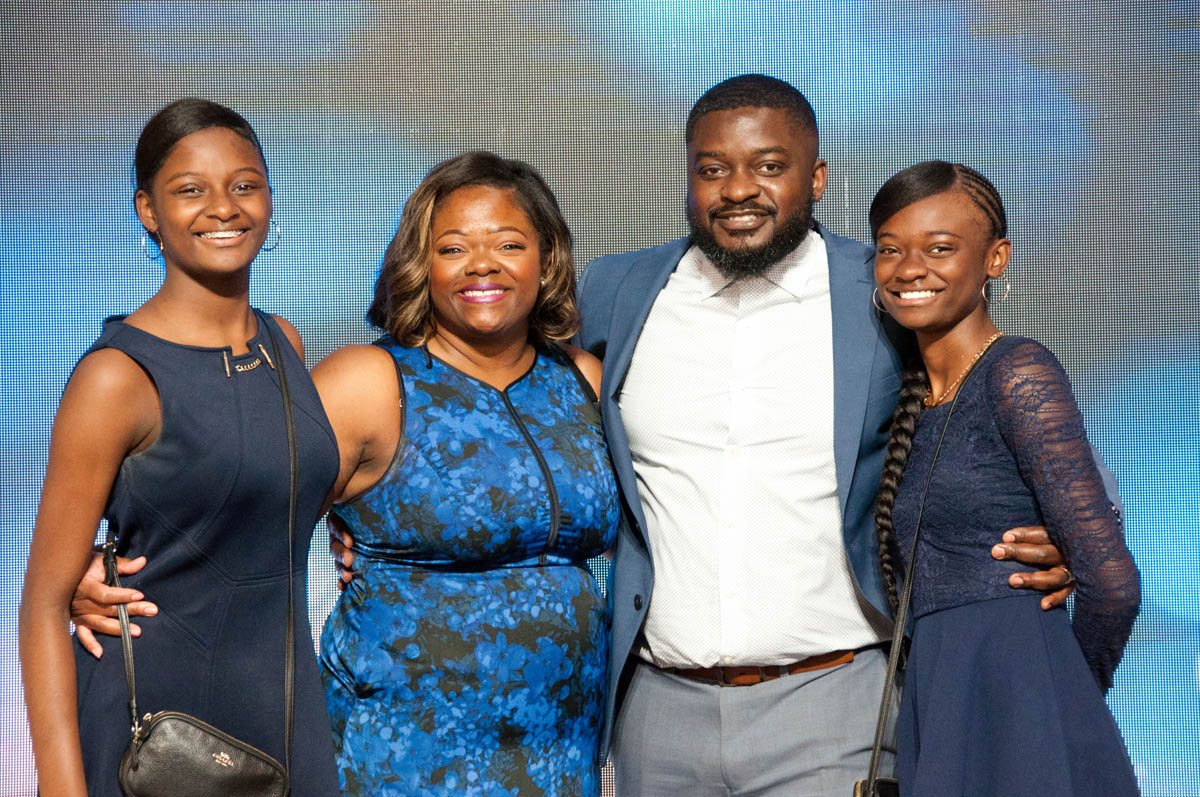 A Promise Land church family smiling together